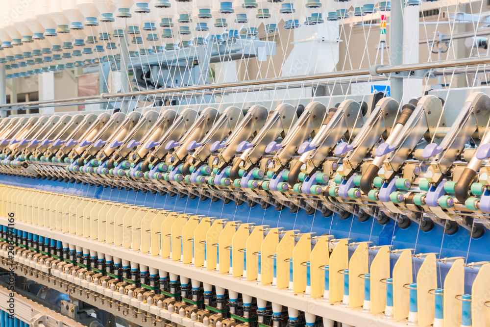 Fototapeta premium Machinery and equipment interior of textiles factory.