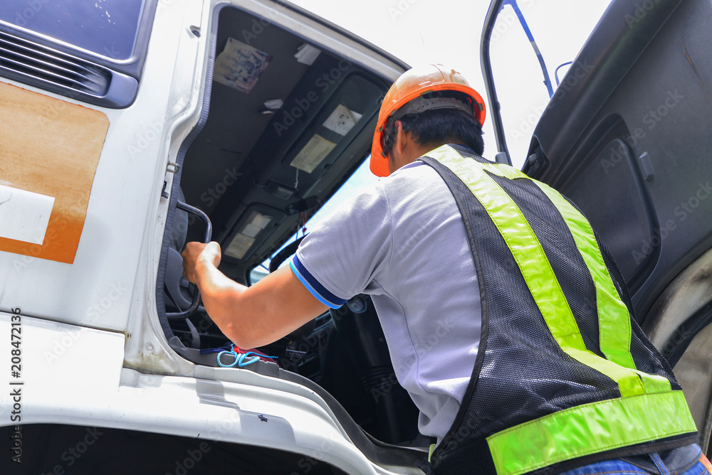 The driver is checking the vehicle before traveling to customer site