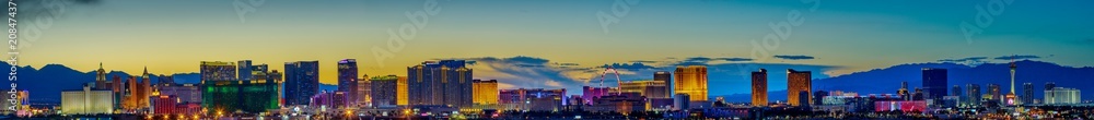 Skyline view at sunset of the famous Las Vegas Strip located in world class hotels and casinos, NV