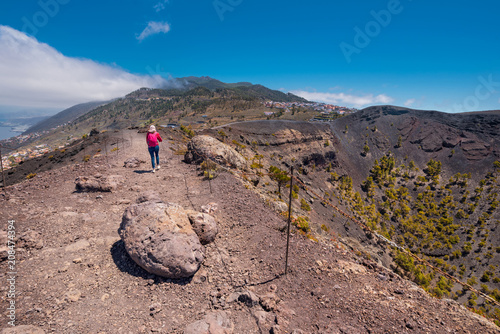 Tourist on Top of San Antonio volcanic crater in La Palma island, Canary islands, Spain.