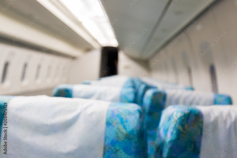 Abstract blurred Inside of train with empty seats interior blur background. Abstract blurred Inside of train with empty seats interior blur background.