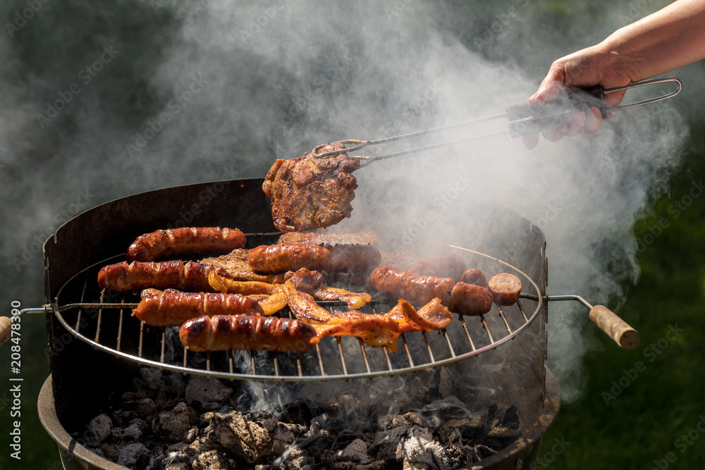 Unhealthy but tasty grilled sausages and meat Unhealthy but tasty grilled sausages and meat