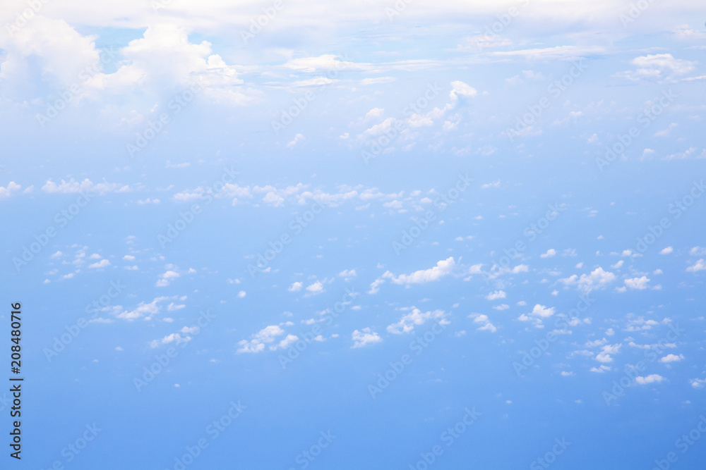 Aerial view from airplane window with sky clouds