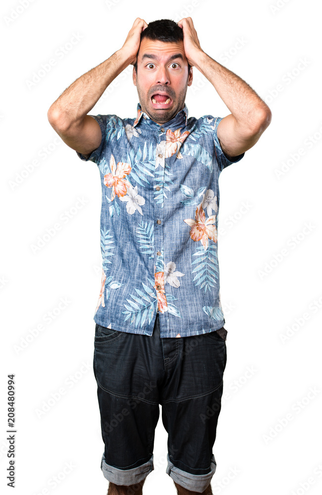 Frustrated handsome man with flower shirt on isolated white background