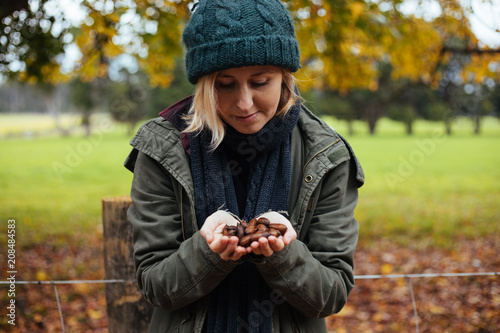 girl harvesting pecan nuts