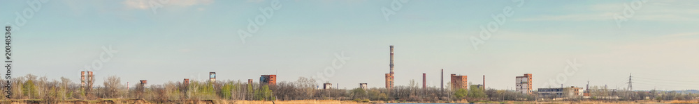 Panorama Old Abandoned chemical factory with chimneys on the banks of the river