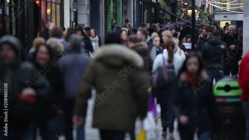 Anonymous crowds of people in Soho, London