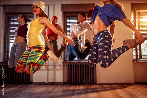 young modern dancers dancing in the studio. Sport, dancing and urban culture concept