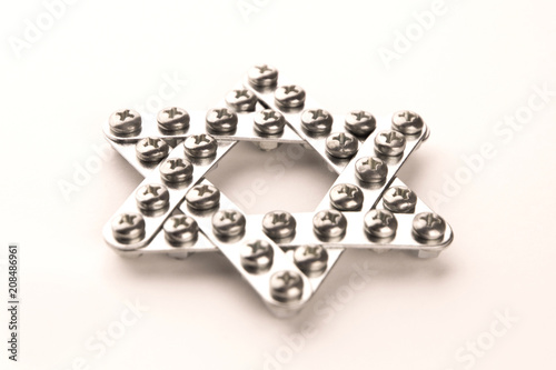 Judaism  star of David  built with meccano  front view  short focus  warm light