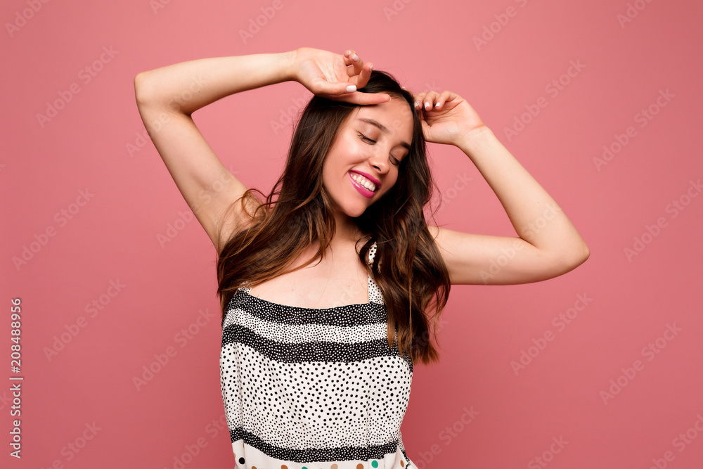 Close-up portrait of excited lovely lady stretching in the morning on isolated background. Indoor photo of stunning european female model in bright dress - obrazy, fototapety, plakaty 