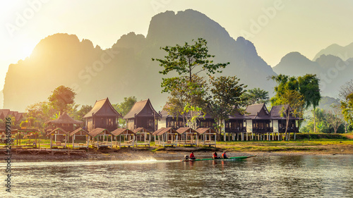 Village and bungalows along Nam Song River in Vang Vieng, Laos. photo