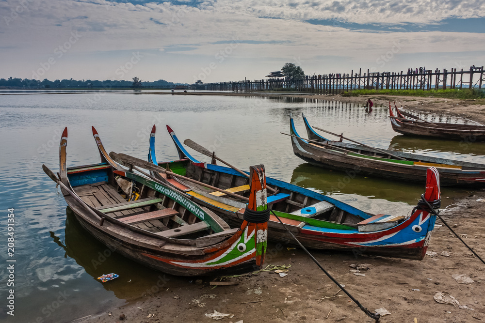 Fish and tourist boats on Taung Tha Man Lake, Amarapura, Myanmar
