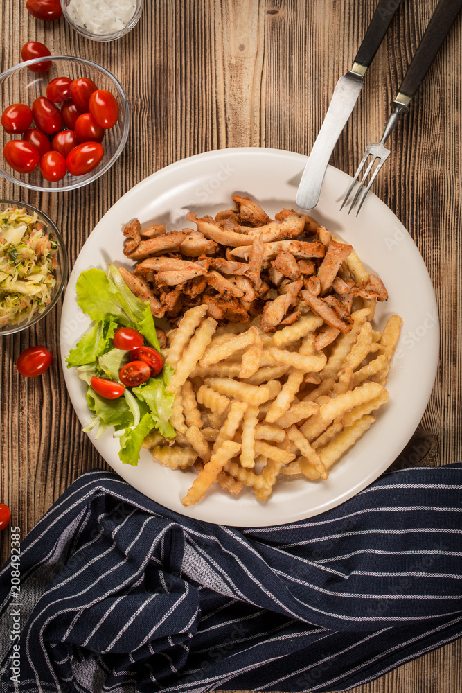 Greek gyros dis with fries and salad Greek gyros dis with fries and salad