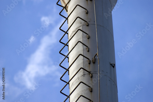 Metallic tube at blue sky background