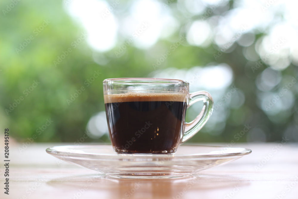 Black coffee is placed on the table. Black coffee is placed on the table.