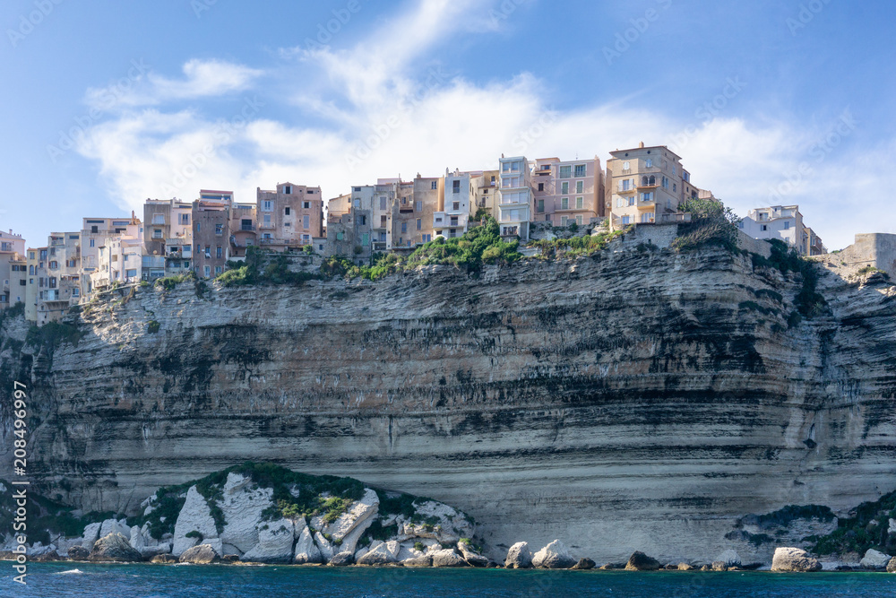 Landscape on Corsica island, Beautiful view of Calvi town with castle on hill in summertime, France