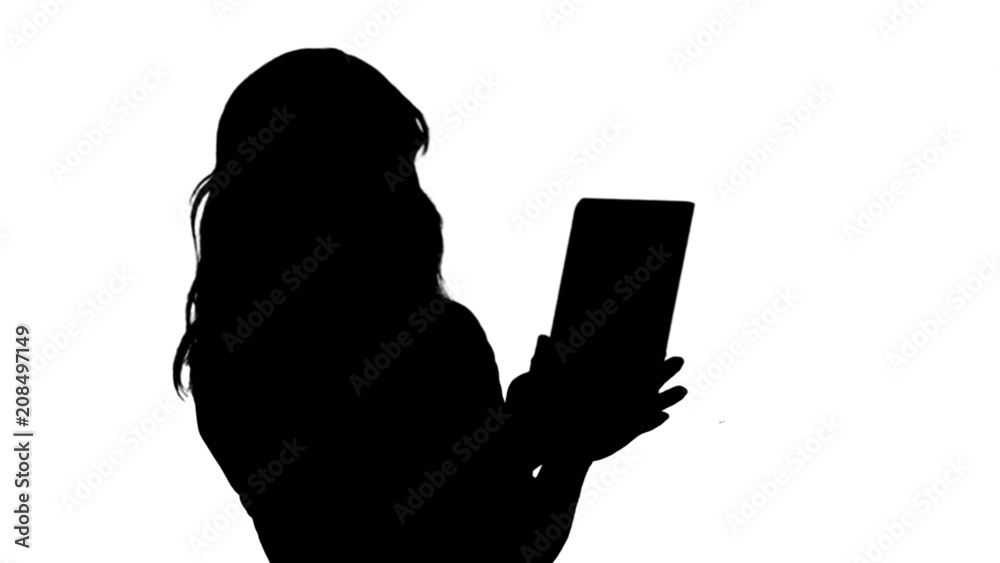 Silhouette Asian business lady chatting using a tablet track matte