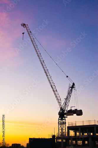 Silhouette of a crane at sunrise
