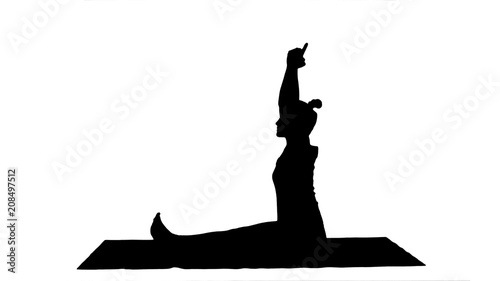 Young girl doing stretching exercises track matte