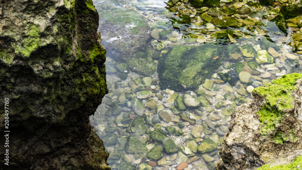 Clear and crystalline sea with rocks