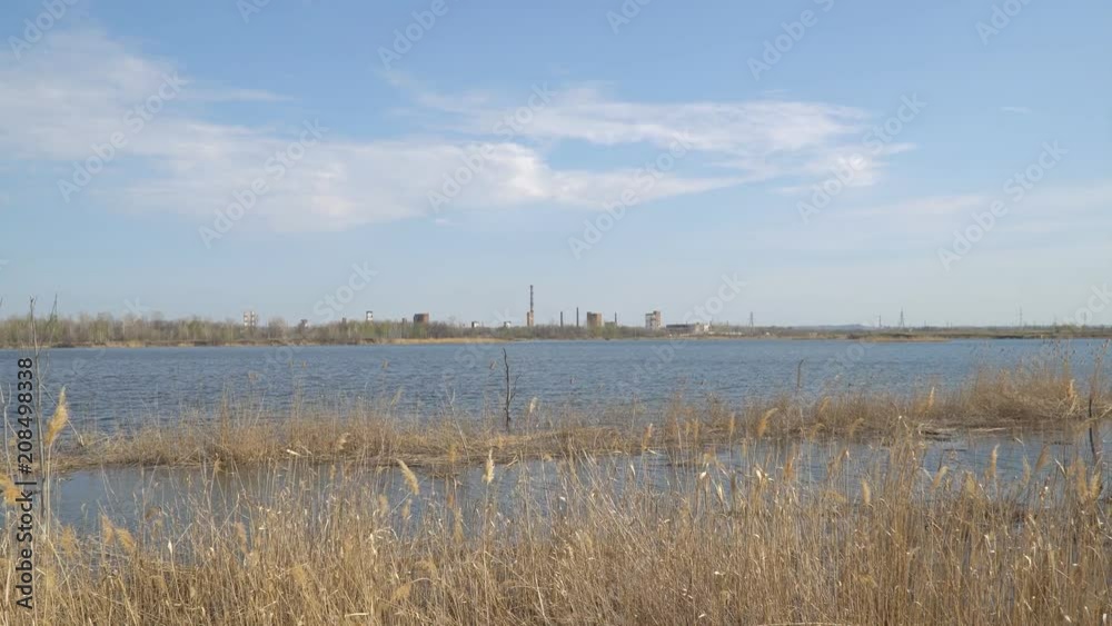 Old Abandoned chemical factory with chimneys on the banks of the river Old Abandoned chemical factory with chimneys on the banks of the river