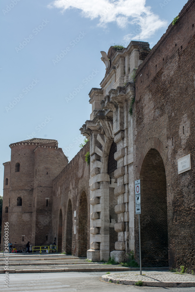 Vertical View of Porta San Giovanni on Blue Sky Background