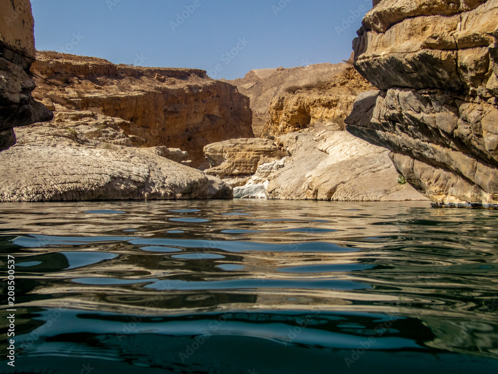 the refreshing cold water of the oasis of Wadi Bani Khalid in Oman