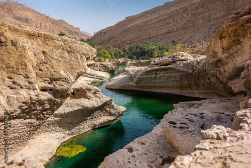 the refreshing cold water of the oasis of Wadi Bani Khalid in Oman photo
