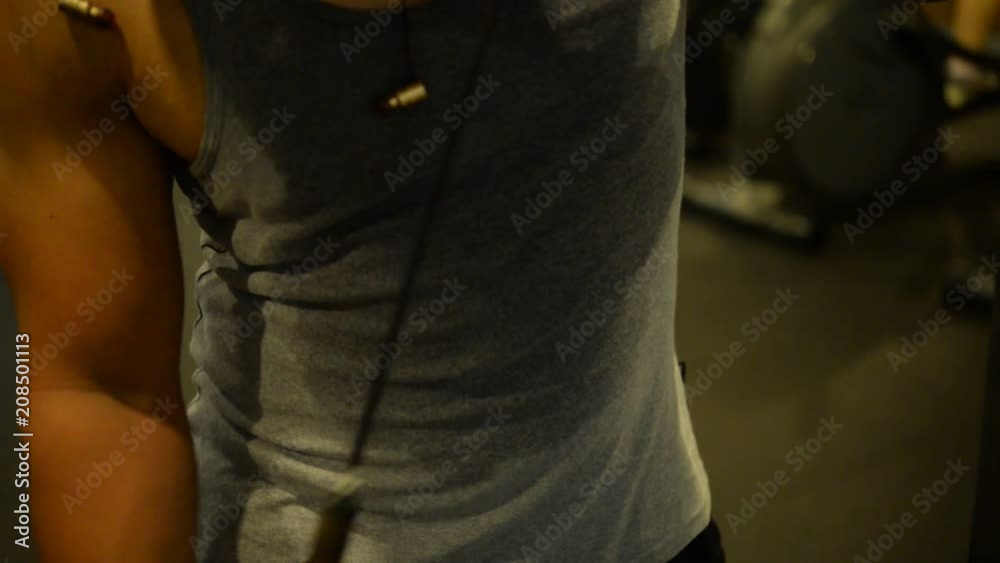 Asian handsome man play fitness in the gym,A muscular young man workout,Thailand people,Love heath concept Asian handsome man play fitness in the gym,A muscular young man workout,Thailand people,Love heath concept