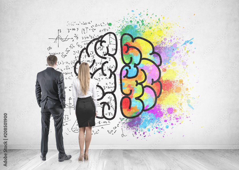 Businessman businesswoman looking at brain sketch Businessman businesswoman looking at brain sketch
