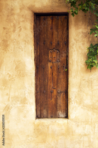 Old Wooden Gate with Security Window in Santa Fe, New Mexico