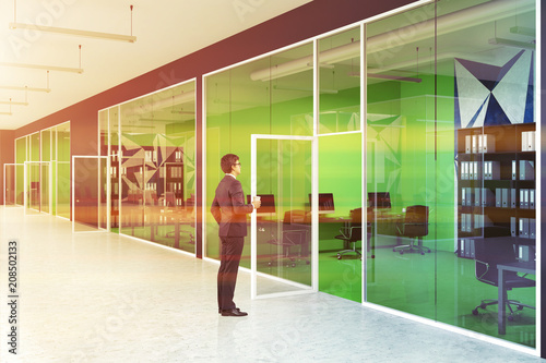 Bright green modern office and lobby, businessman