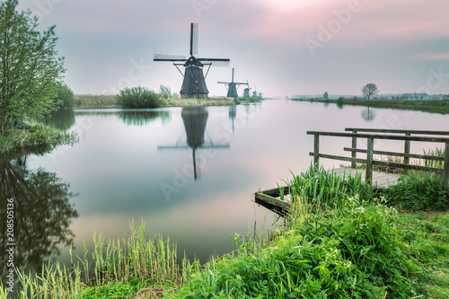 Windmill reflected in the canal Kinderdijk Rotterdam South Holland Netherland Europe © EyesTravelling