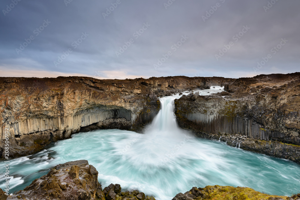 Aldeyjarfoss is an amazing waterfall in northern Iceland. Icelandic natural landscape at sunrise. Aldeyjarfoss is an amazing waterfall in northern Iceland. Icelandic natural landscape at sunrise.