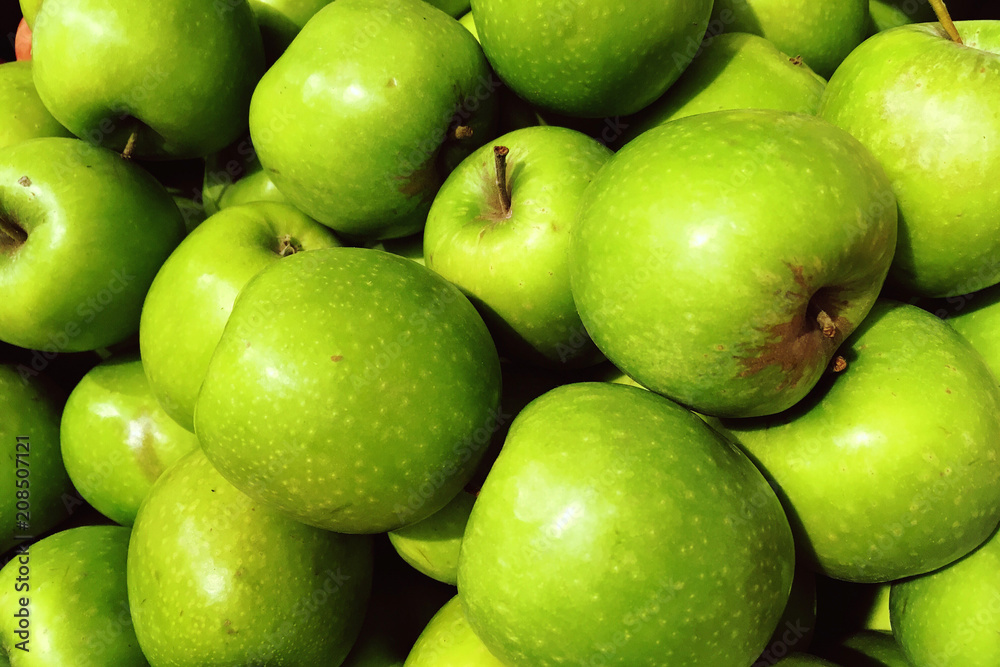green apples in the shop window and the store, useful vegetarian food green apples in the shop window and the store, useful vegetarian food