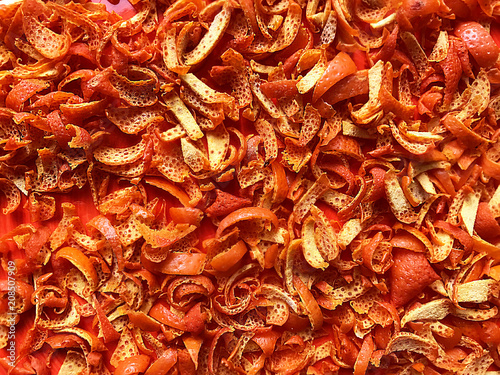 Dried tangerine peel on a red platter.