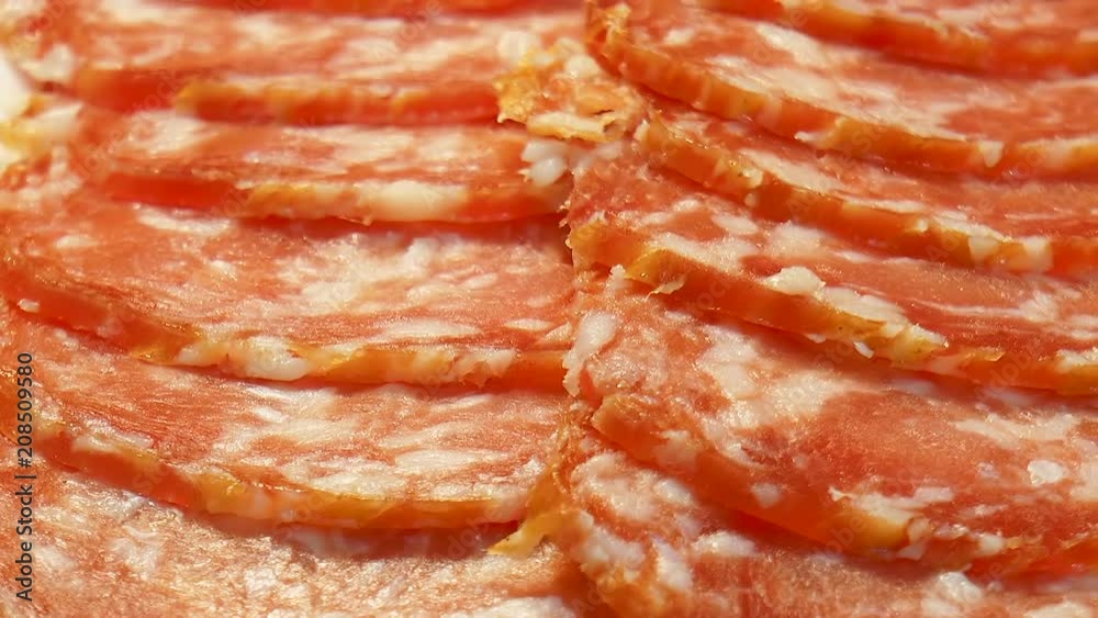 Video shows Slices of sliced smoked sausage Video shows Slices of sliced smoked sausage