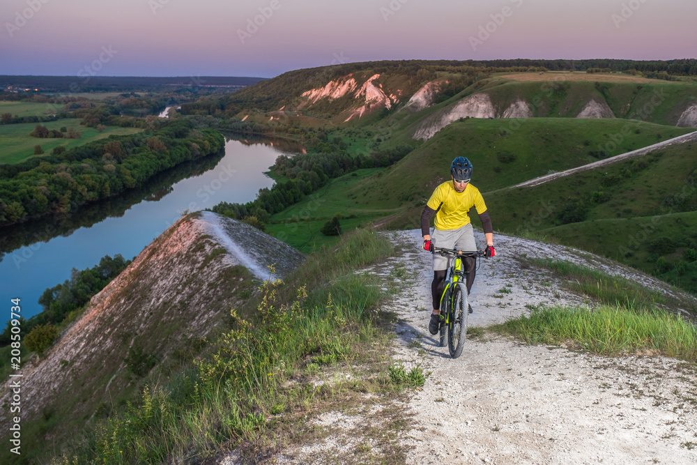 Cyclist Riding the Bike on the Beautiful Mountain Trail. 