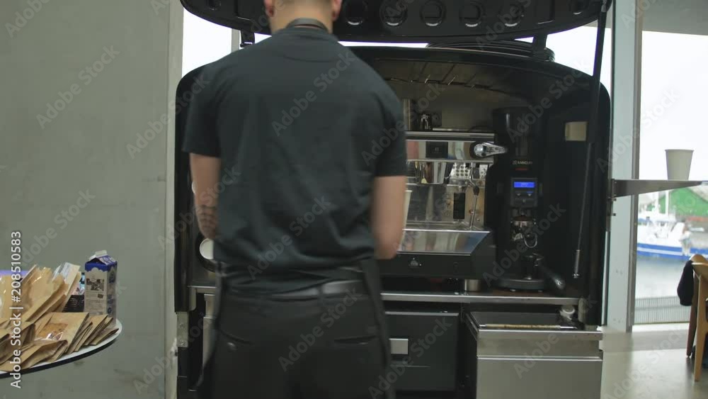 Barista making coffee at remote coffee brewery. Barista making coffee at remote coffee brewery.