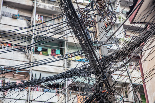 messy, chaotic power and telephone cables