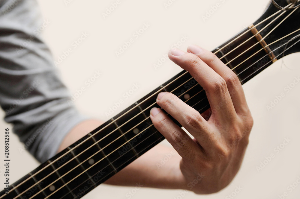 Fototapeta premium Guitar chords,Selective focus,Guitarist,The musicians are catching the guitar chords is F sharp minor chord on white background