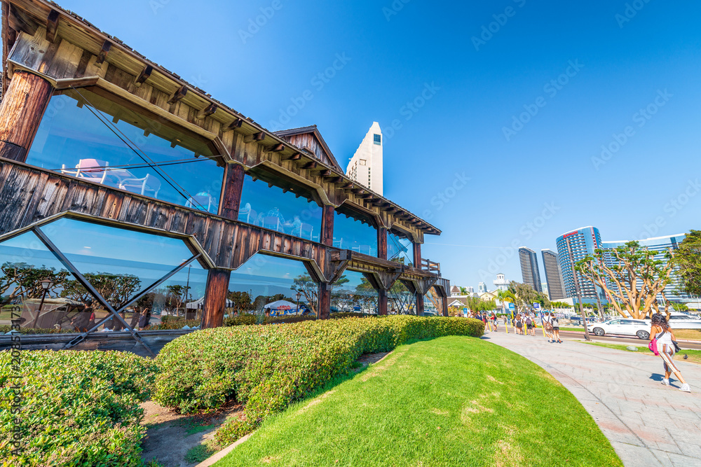 Fototapeta premium SAN DIEGO - JULY 30, 2017: San Diego skyline and buildings along sea promenade. The city attracts 10 million tourists annually