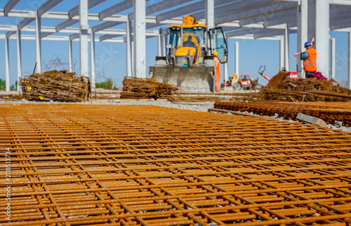 Pile of rusty reinforcing mesh, armature stacked temporarily