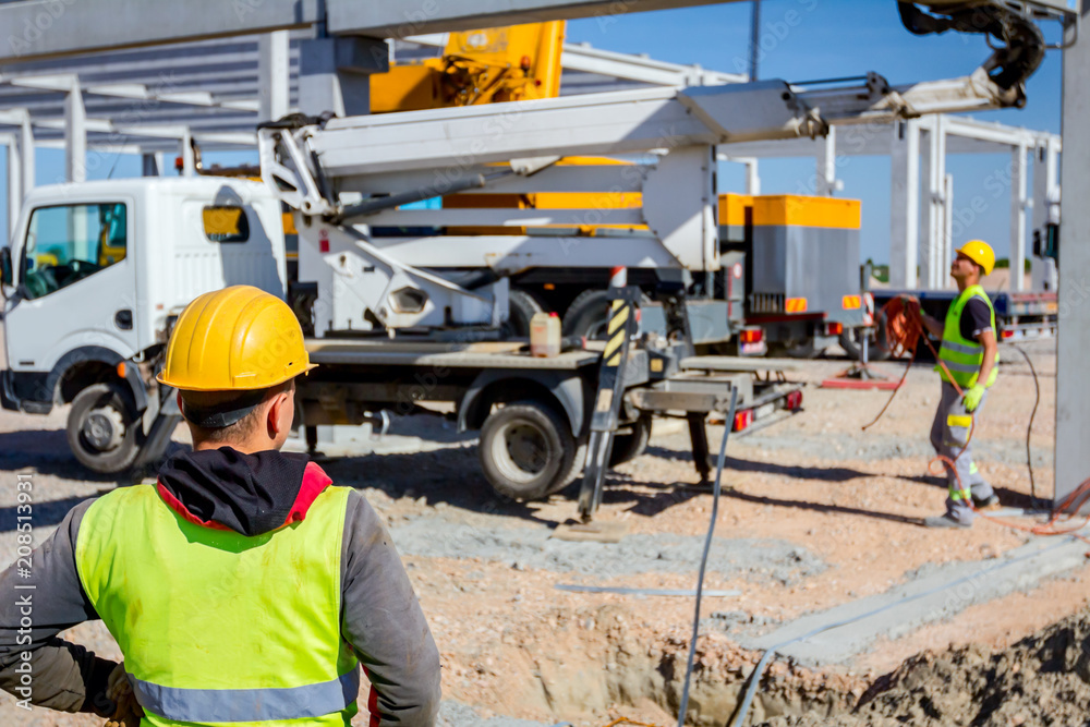 Boss oversees, control work on construction site Boss oversees, control work on construction site