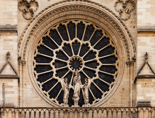 Close up of rose window in Notre Dame cathedral in Paris.