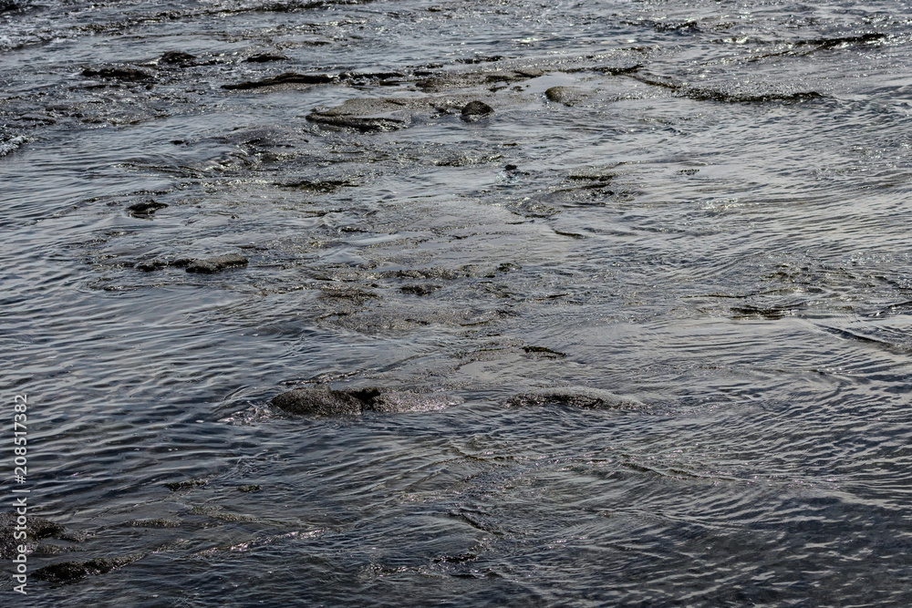 Fototapeta premium Dark blue textured water of the Pacific Ocean as a nature background 