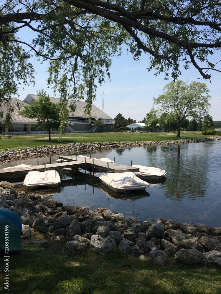 Naklejka premium covered boats on pond