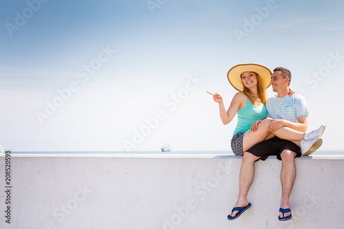 Man and woman sitting together outside
