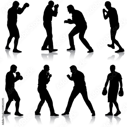 Black set silhouette of an athlete boxer on a white background