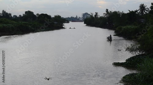 person sailing simple boat